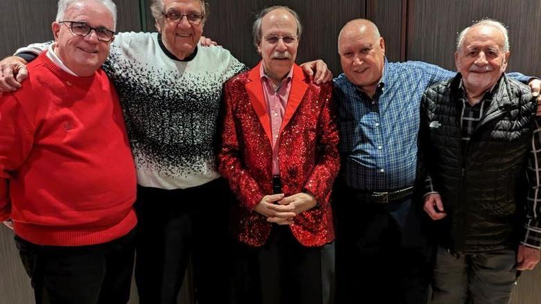 Five Penn State alumni dressed for a holiday party